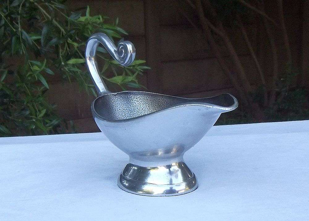 A STUNNING CARROL BOYES STYLE METAL SAUCE OR GRAVY BOAT