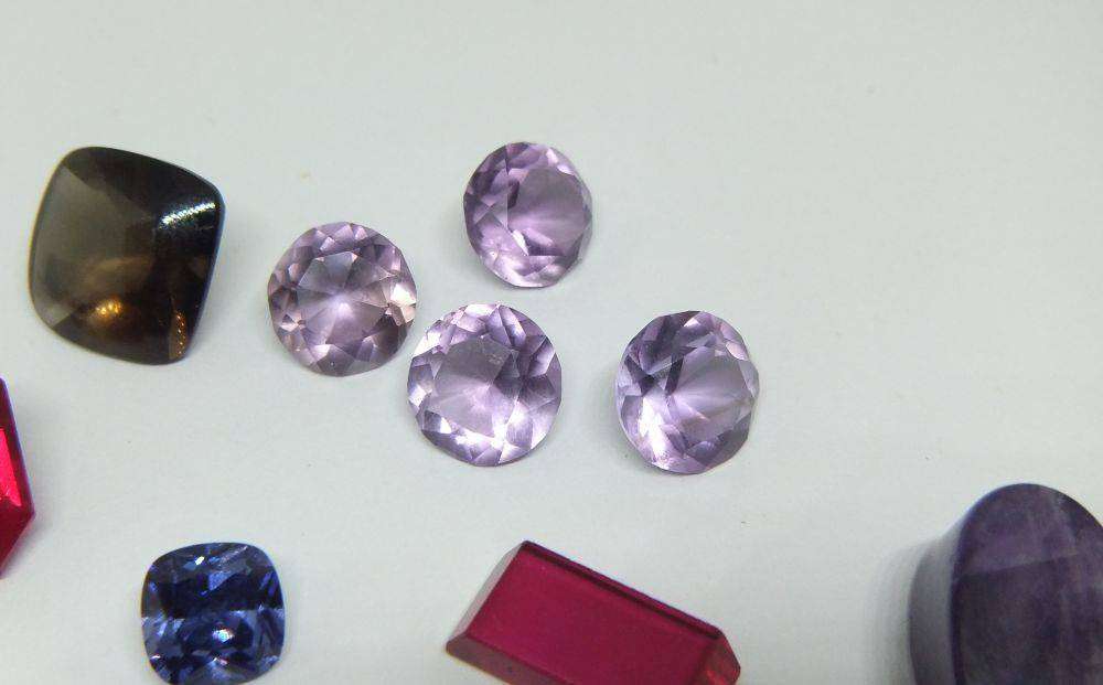Various gorgeous cabochon and faceted stones removed from gold jewelry