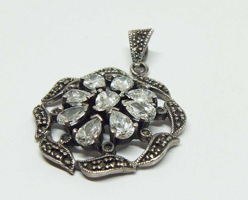 An exquisite vintage style sterling silver pendant with faceted insets and marcasite