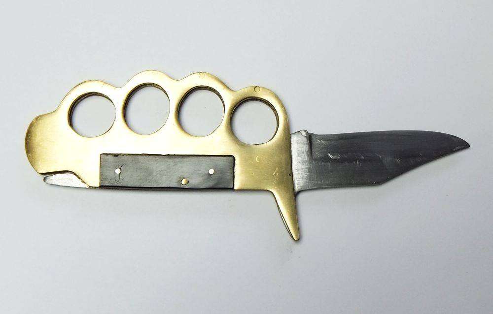 A rarely seen vintage brass knuckle duster knife combo in great working condition