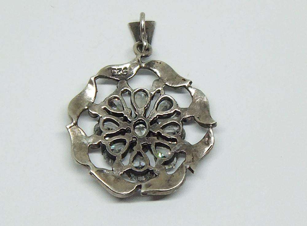 An exquisite vintage style sterling silver pendant with faceted insets and marcasite