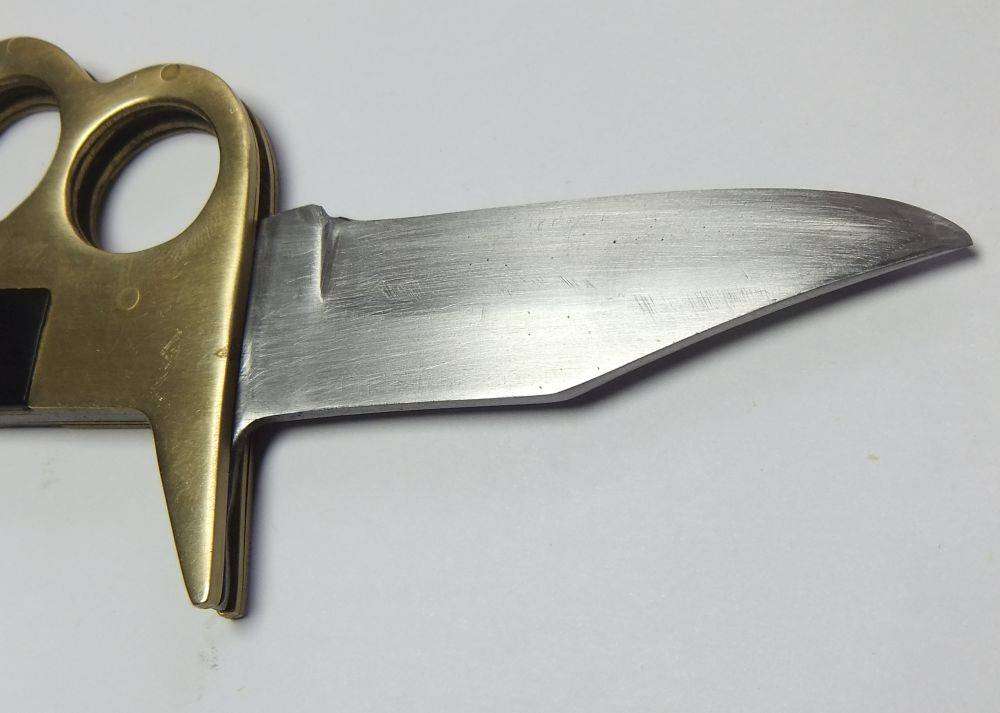 A rarely seen vintage brass knuckle duster knife combo in great working condition