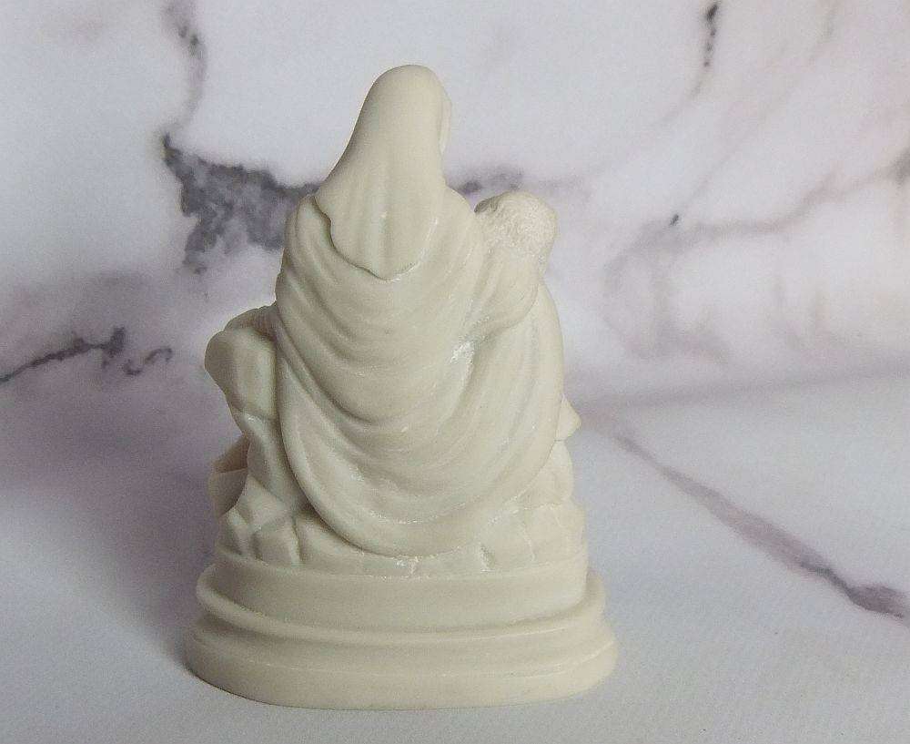 A vintage solid resin statuette of the Pieta by Michelangelo