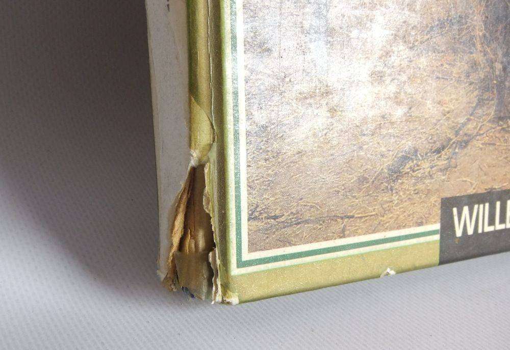 A vintage SA army helmet , water bottle and a book about the South African Border War