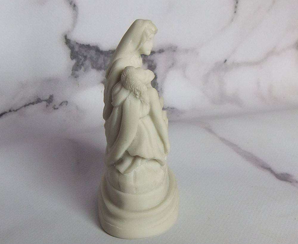 A vintage solid resin statuette of the Pieta by Michelangelo