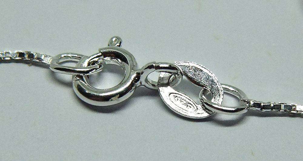 A vintage sterling silver Libra Zodiac sign pendant with a sterling silver necklace