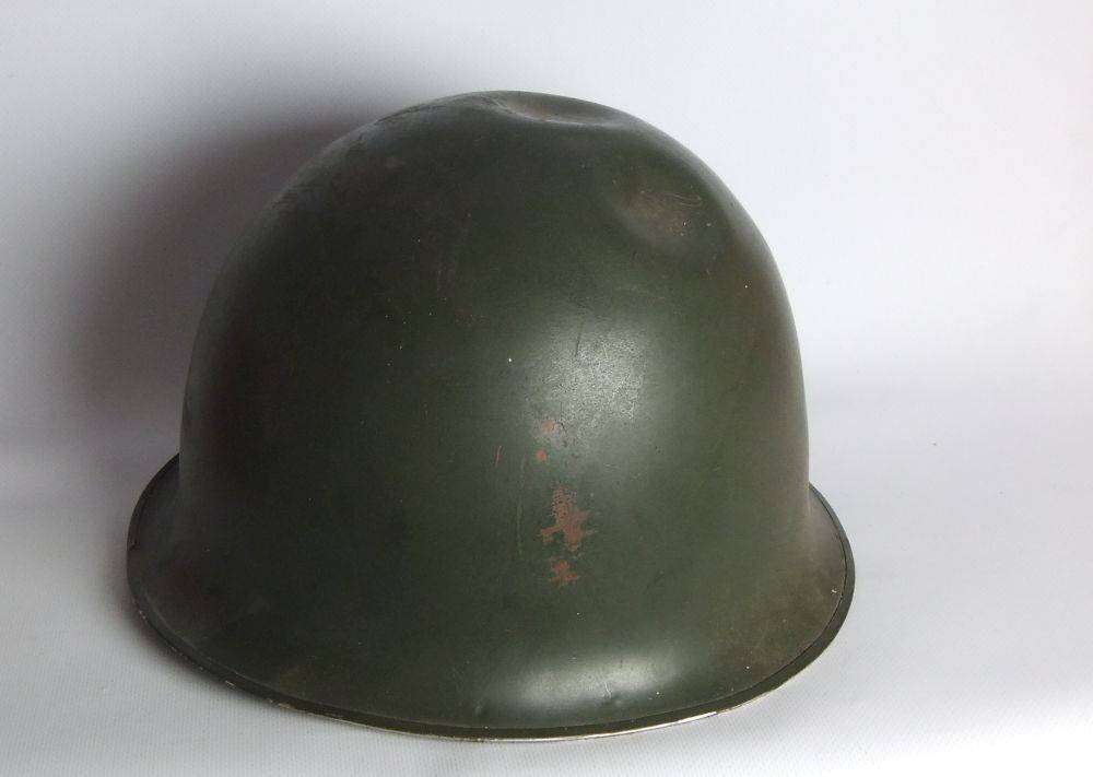 A vintage SA army helmet , water bottle and a book about the South African Border War