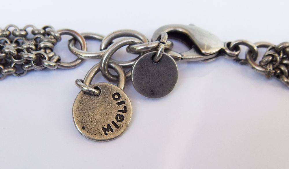 A gorgeous high class genuine Miglio metal necklace with faceted heart pendant