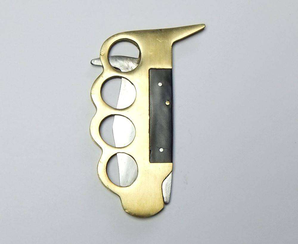 A rarely seen vintage brass knuckle duster knife combo in great working condition
