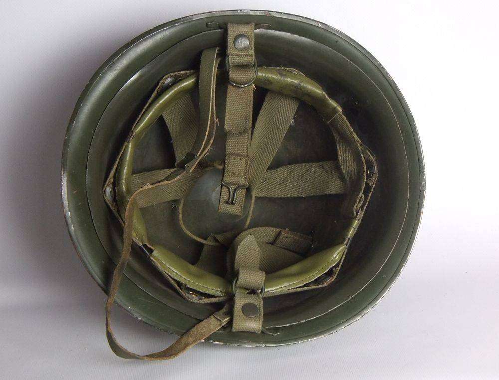 A vintage SA army helmet , water bottle and a book about the South African Border War