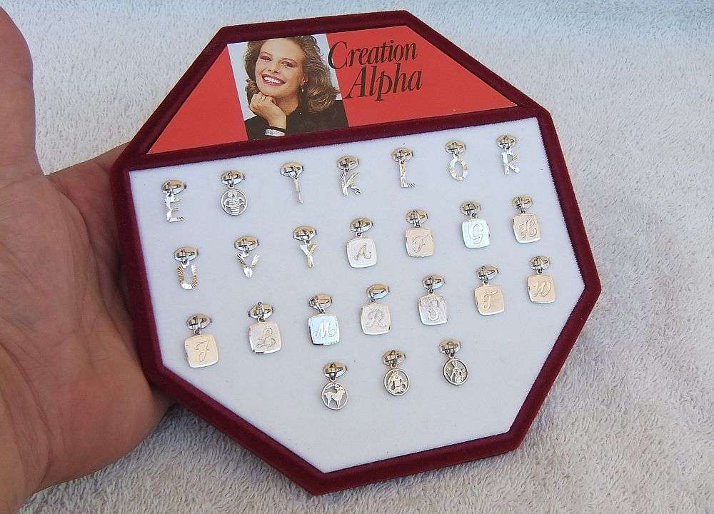 AN AMAZING LOT OF 24 SOLID SILVER PENDANTS - BRAND NEW VINTAGE STOCK - GERMAN AND STERLING SILVER !!