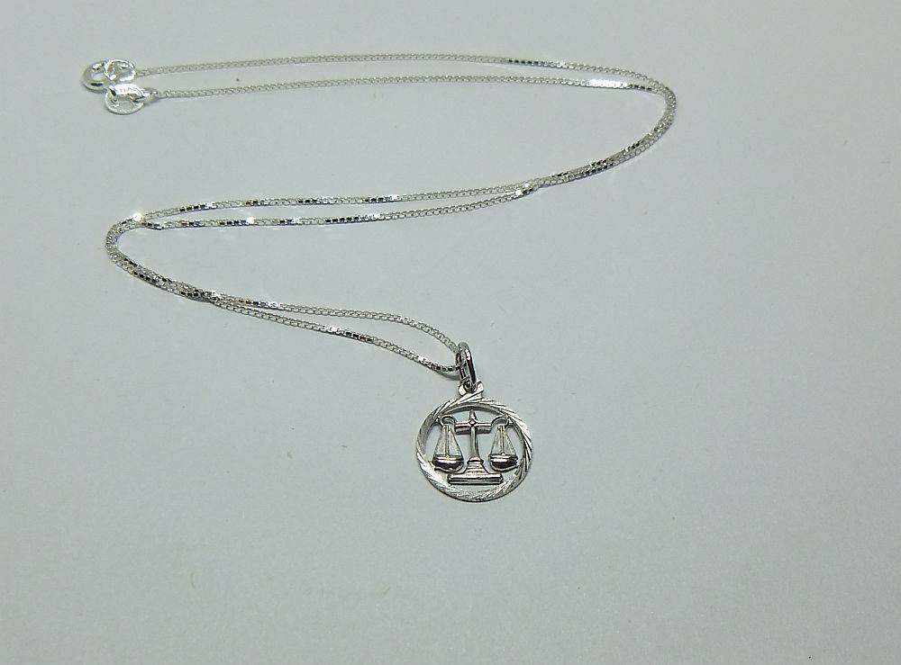 A vintage German 835 silver Libra Zodiac sign pendant with a sterling silver necklace