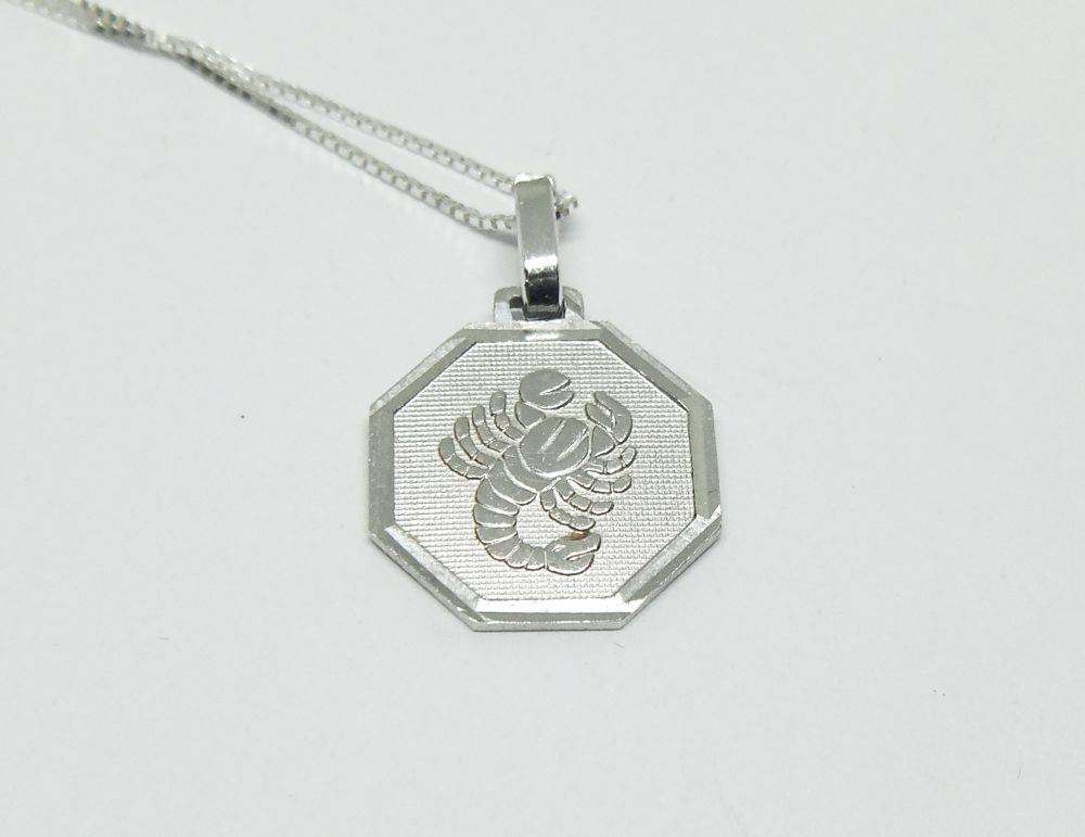 A vintage sterling silver Cancer Zodiac sign pendant plus a sterling silver necklace