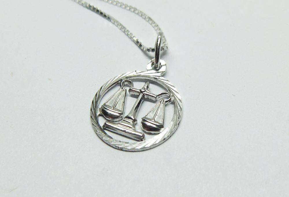 A vintage German 835 silver Libra Zodiac sign pendant with a sterling silver necklace