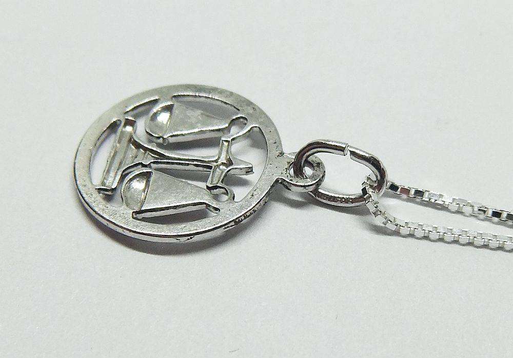 A vintage German 835 silver Libra Zodiac sign pendant with a sterling silver necklace