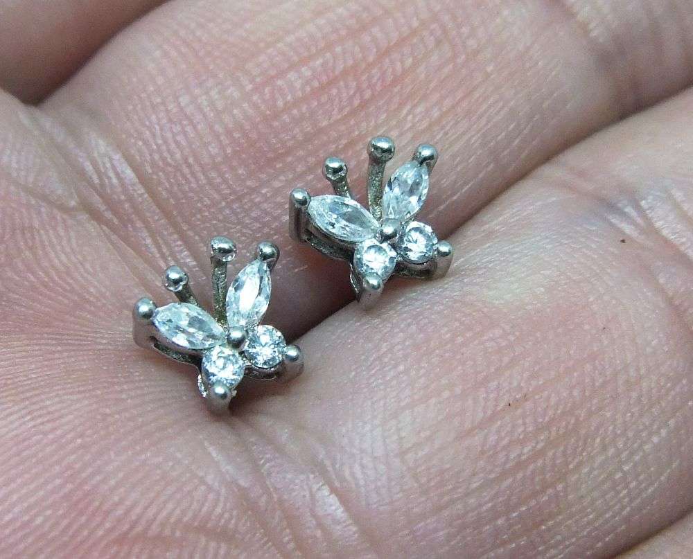 A CHARMING PAIR OF FACETED CZ SET STERLING SILVER BUTTERFLY MOTIF STUD EARRINGS IN GREAT CONDITION