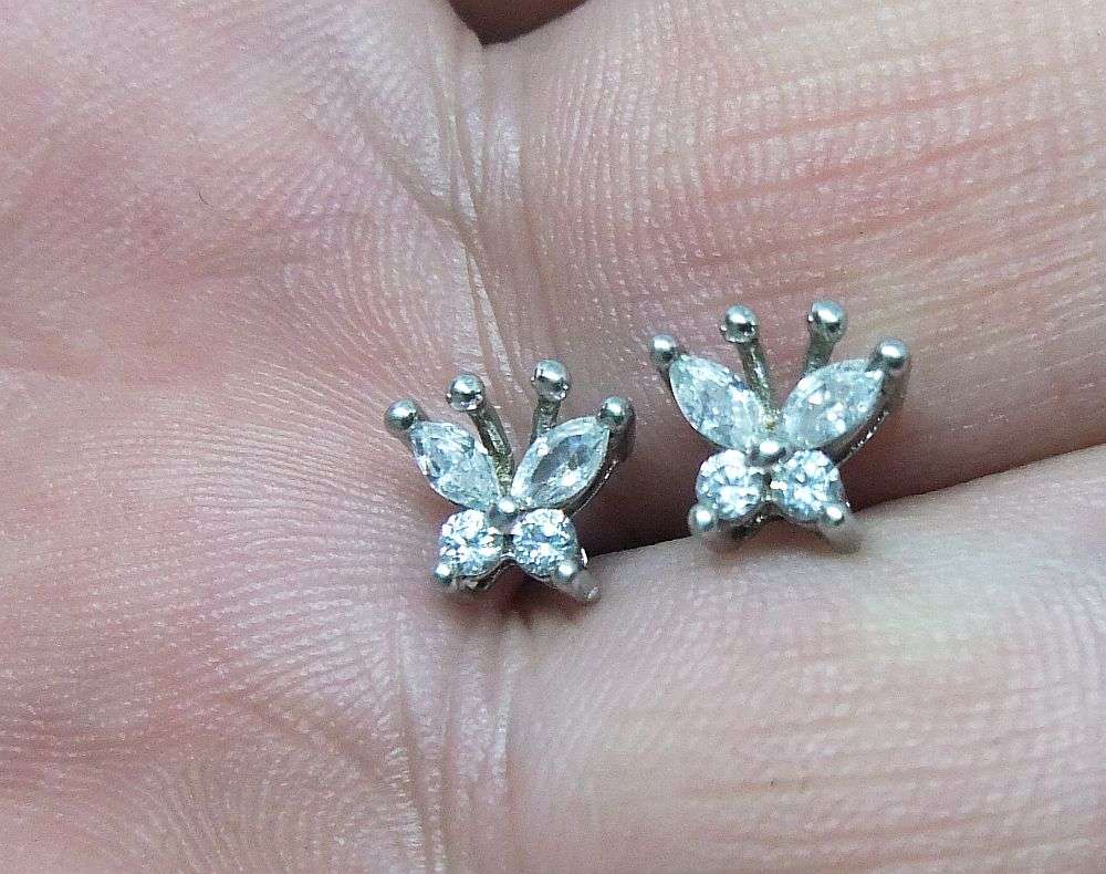 A CHARMING PAIR OF FACETED CZ SET STERLING SILVER BUTTERFLY MOTIF STUD EARRINGS IN GREAT CONDITION