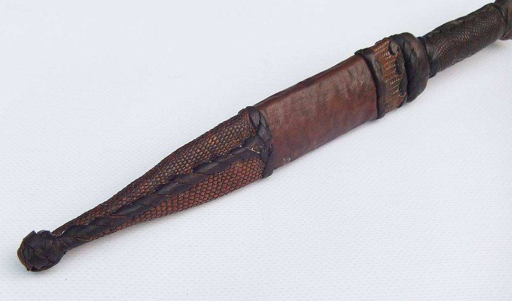 A rare antique North African Tuareg tribal dagger with leather sheath and handle