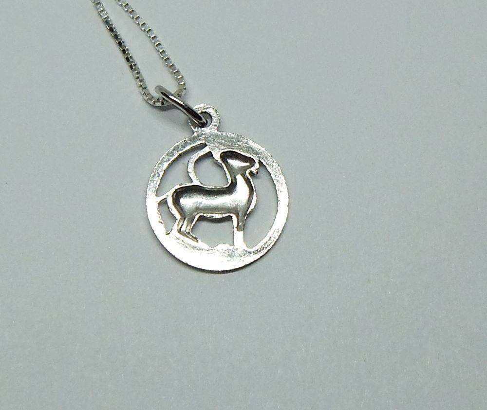 A vintage German silver Capricorn Zodiac sign pendant with a sterling silver necklace