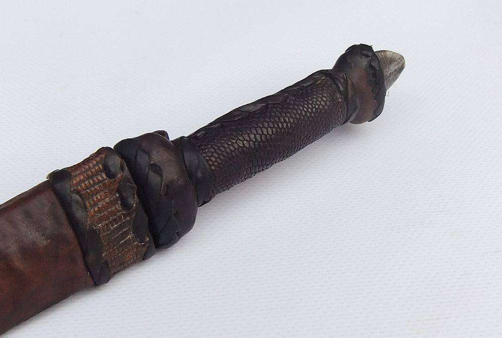 A rare antique North African Tuareg tribal dagger with leather sheath and handle