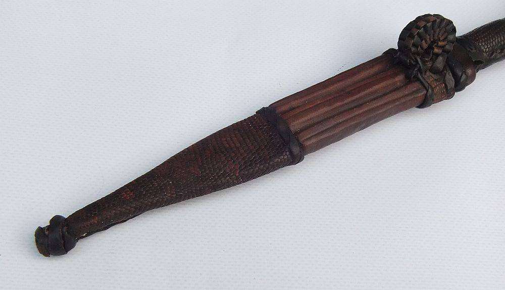 A rare antique North African Tuareg tribal dagger with leather sheath and handle