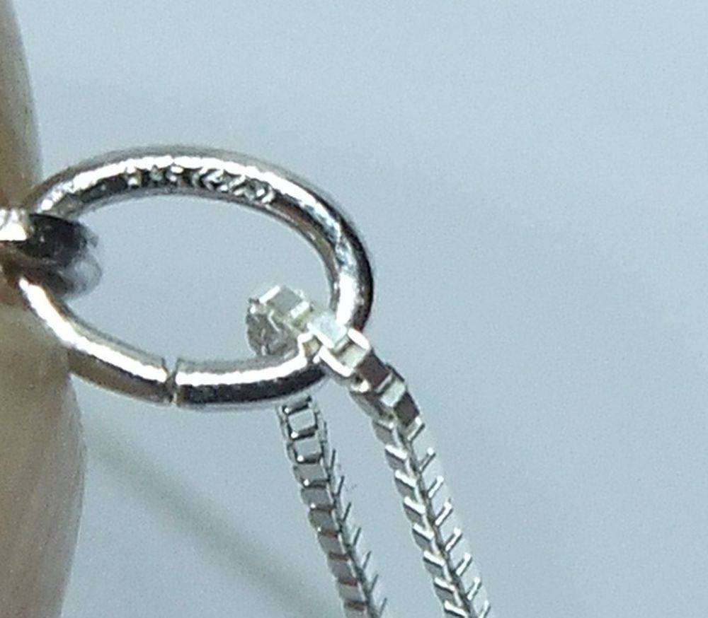 A vintage German silver Capricorn Zodiac sign pendant with a sterling silver necklace