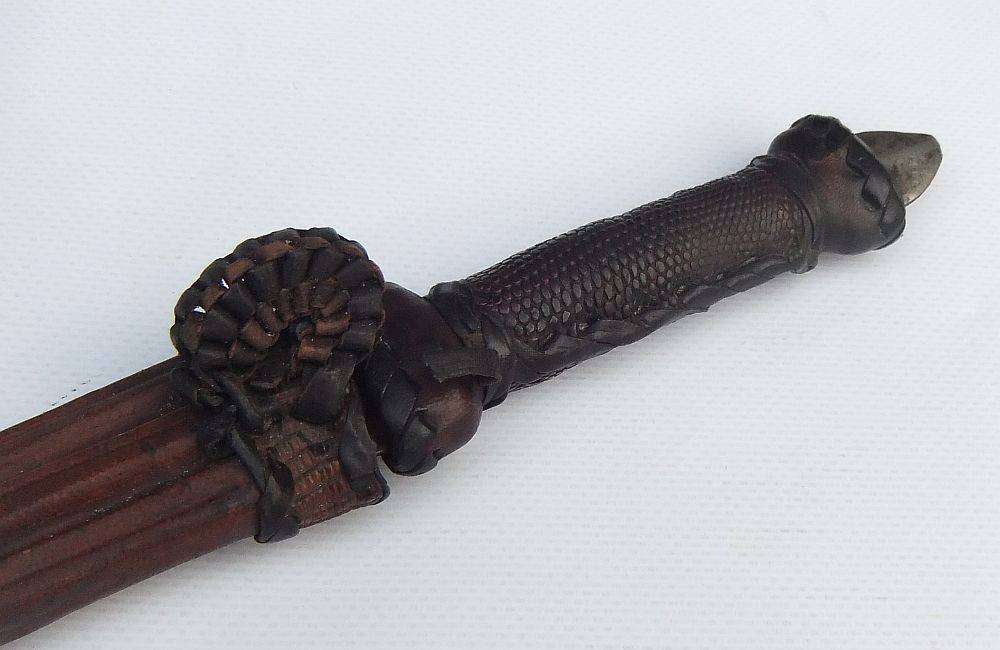 A rare antique North African Tuareg tribal dagger with leather sheath and handle