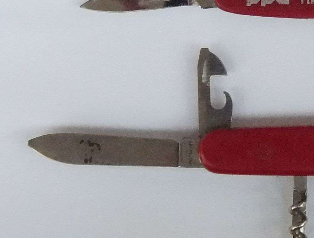 THREE VINTAGE VICTORINOX POCKET KNIVES  AND A NO NAME POCKET KNIFE WITH ADVERTISING