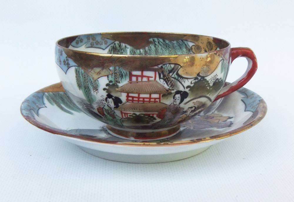 A stunning signed hand painted antique Japanese porcelain duo