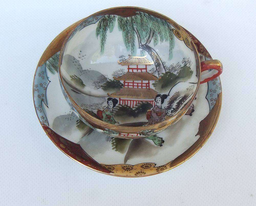 A stunning signed hand painted antique Japanese porcelain duo