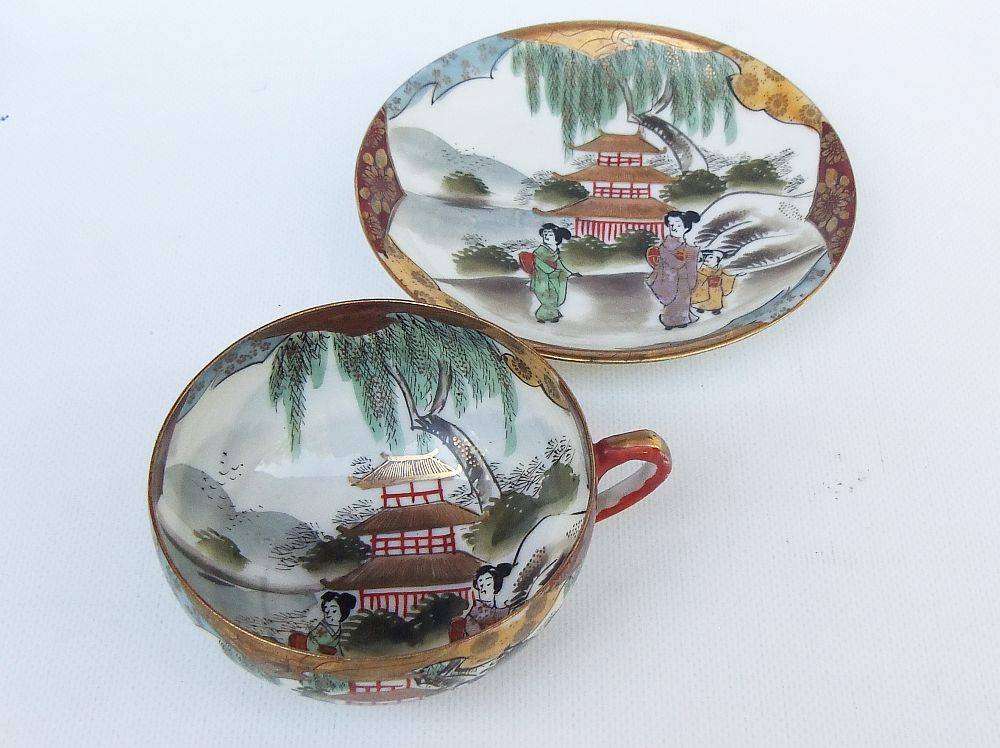A stunning signed hand painted antique Japanese porcelain duo
