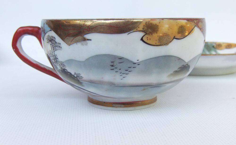 A stunning signed hand painted antique Japanese porcelain duo