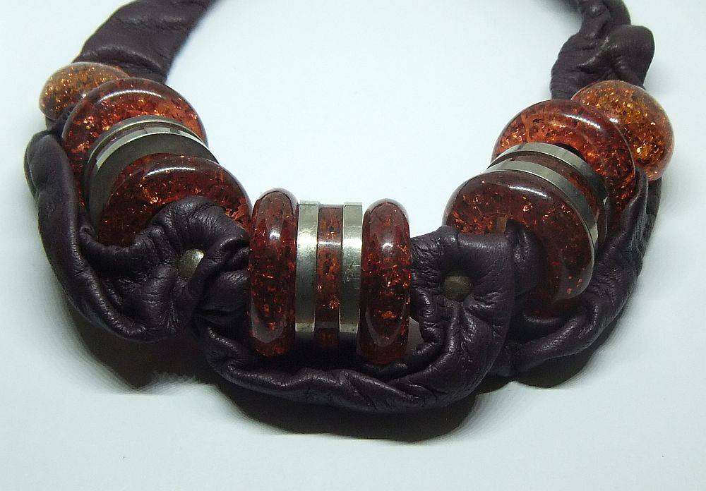 A vintage leather , acrylic bead and metal necklace by modernist Italian designer Wilma Spagli