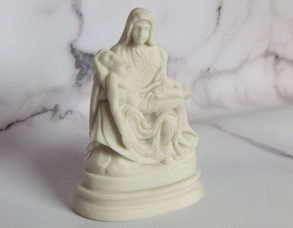 A vintage solid resin statuette of the Pieta by Michelangelo