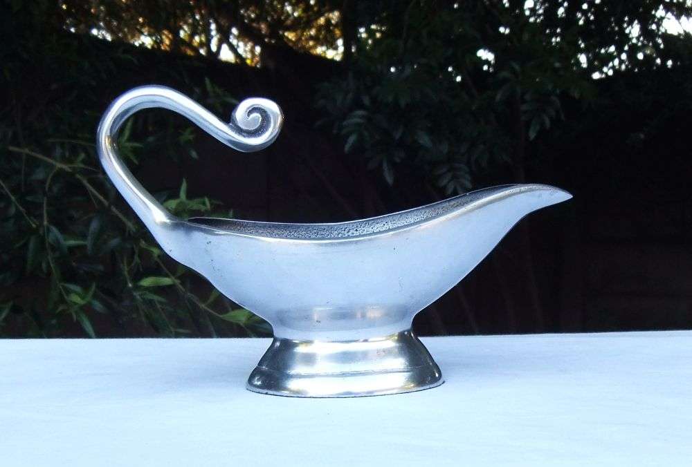 A STUNNING CARROL BOYES STYLE METAL SAUCE OR GRAVY BOAT