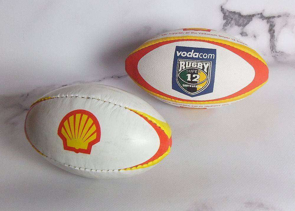 Two vintage miniature rugby balls made for the Vodacom Super 12 advertising Shell oil or fuel
