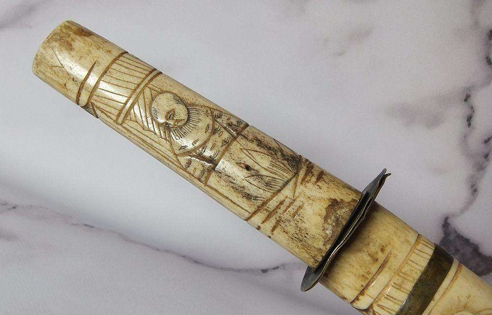 AN ABSOLUTELY RARE ANTIQUE JAPANESE CARVED BONE SHORT SWORD IN DISPLAY CONDITION - NOT FOR USE