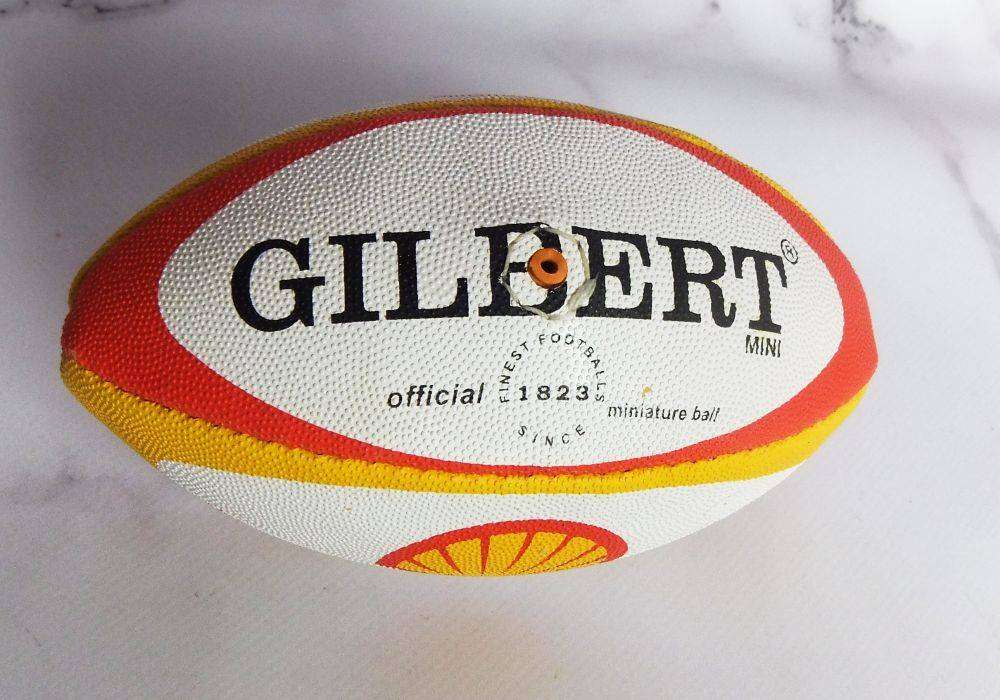Two vintage miniature rugby balls made for the Vodacom Super 12 advertising Shell oil or fuel