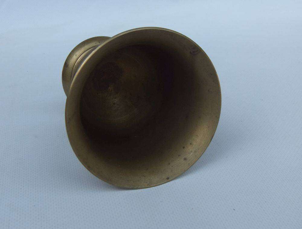 A vintage solid brass mortar and pestle in good condition