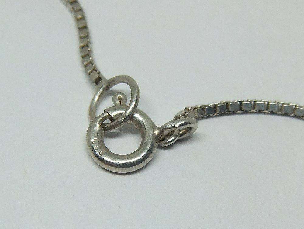 A quality sterling silver necklace with unique "Love, Life, Luck" theme pendants in great condition