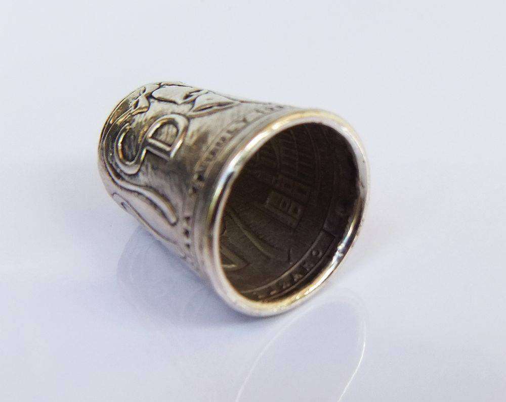 A vintage hallmarked sterling silver thimble made to commemorate the marriage of Charles & Diana