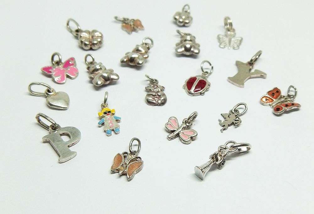 WOW !! AN ADORABLE LOT OF 19 STERLING SILVER CHARMS !! BID FOR THE LOT !!