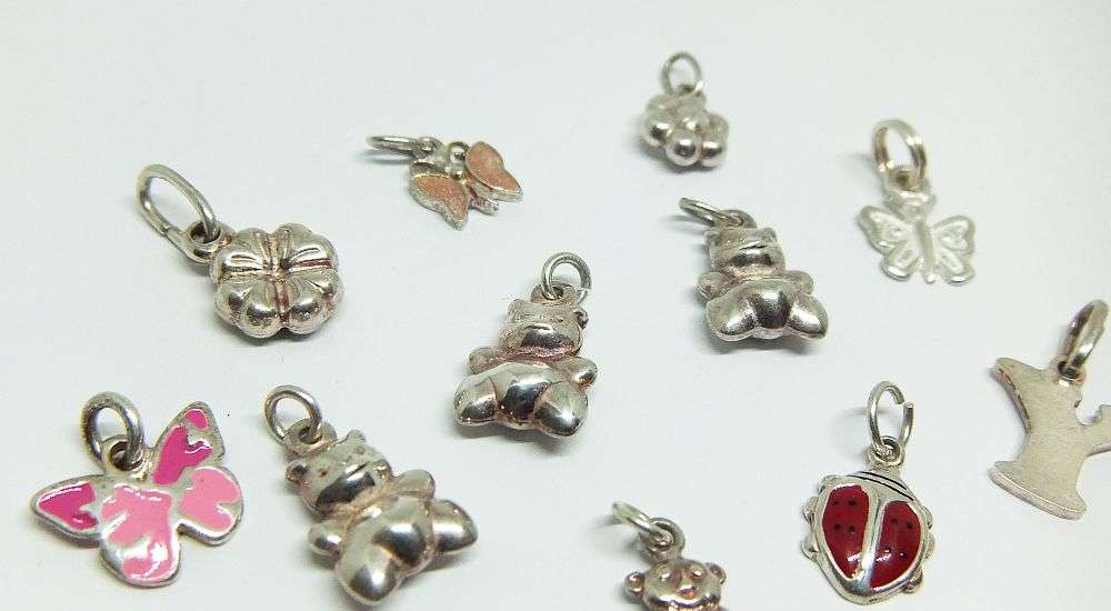 WOW !! AN ADORABLE LOT OF 19 STERLING SILVER CHARMS !! BID FOR THE LOT !!