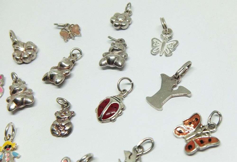 WOW !! AN ADORABLE LOT OF 19 STERLING SILVER CHARMS !! BID FOR THE LOT !!