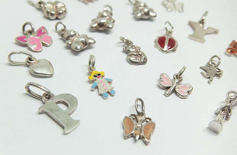 WOW !! AN ADORABLE LOT OF 19 STERLING SILVER CHARMS !! BID FOR THE LOT !!