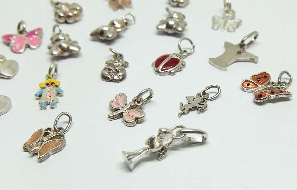 WOW !! AN ADORABLE LOT OF 19 STERLING SILVER CHARMS !! BID FOR THE LOT !!