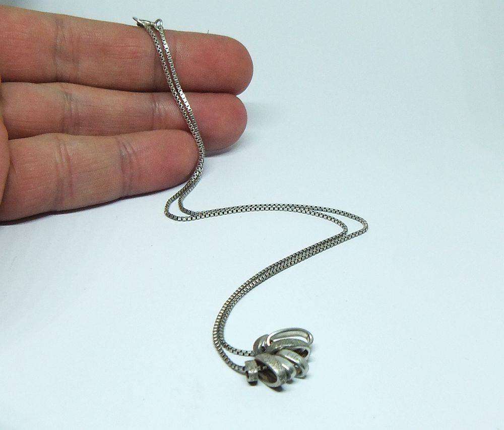 A quality sterling silver necklace with unique "Love, Life, Luck" theme pendants in great condition