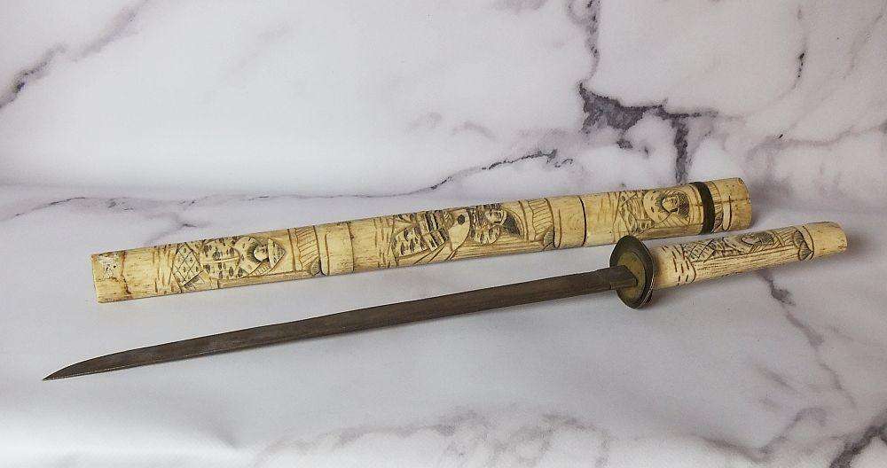 AN ABSOLUTELY RARE ANTIQUE JAPANESE CARVED BONE SHORT SWORD IN DISPLAY CONDITION - NOT FOR USE
