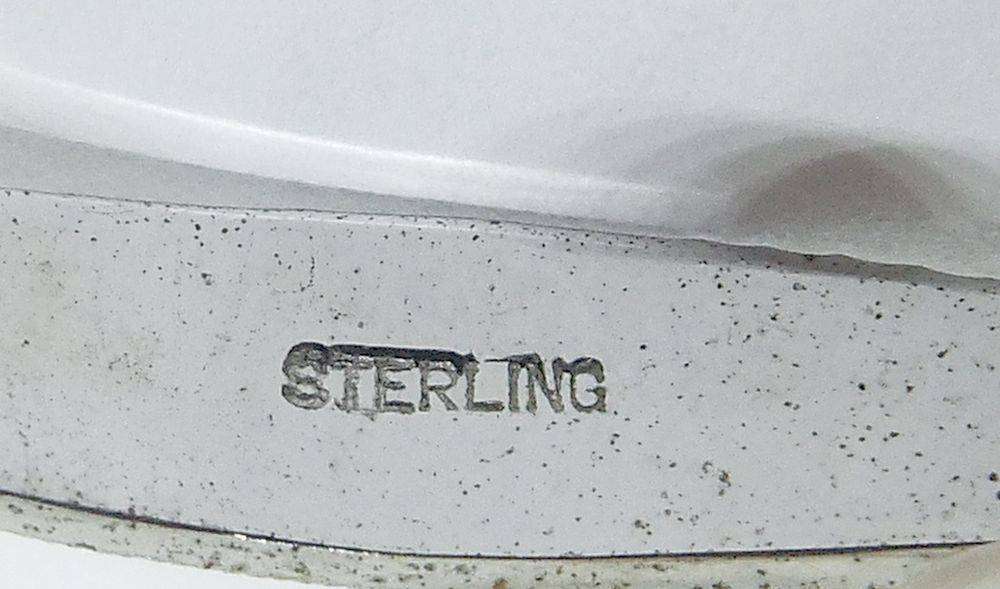 A classy vintage sterling silver brooch set with genuine pearls in excellent condition