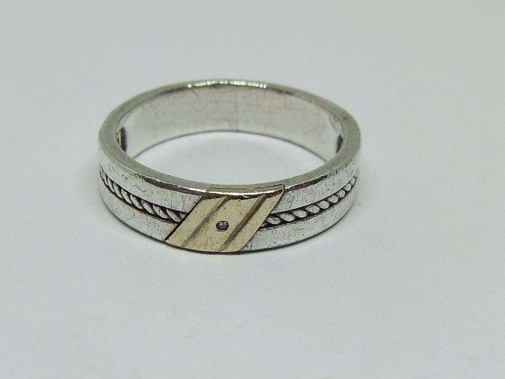 A stylish South African designer sterling silver mens wedding band with gold accent and stone